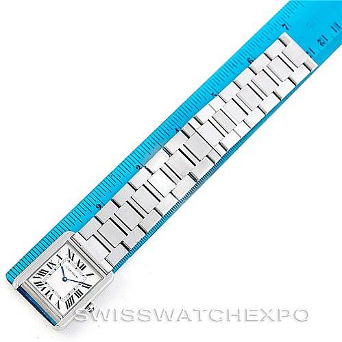 The image shows a top-down view of a Cartier Tank Solo W5200014 Men
s Stainless Steel Silver Dial W5200014 Men
s Stainless Steel Silver Dial watch, highlighting the face and the metal bracelet measured against a ruler.