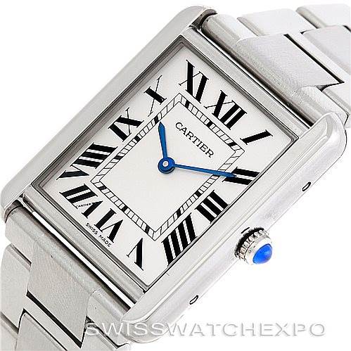 The image shows a Cartier Tank Solo W5200014 Men
s Stainless Steel Silver Dial W5200014 Men
s Stainless Steel Silver Dial watch at an angled view, highlighting its face, Roman numerals, blue hands, and linked bracelet.