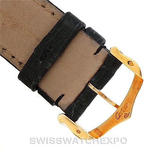 The image shows a close-up of the Cartier Tank Solo W1018855 Men's Steel and Gold (two tone) Silver Dial W1018855 Men's Steel and Gold (two tone) Silver Dial watch strap, focusing on the black leather and gold-tone buckle.