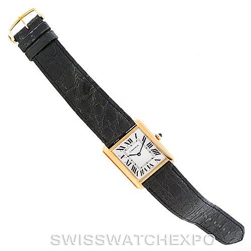 The image shows a Cartier Tank Solo W1018855 Men's Steel and Gold (two tone) Silver Dial W1018855 Men's Steel and Gold (two tone) Silver Dial watch at an angled top view, displaying the face, black leather strap, and gold buckle.