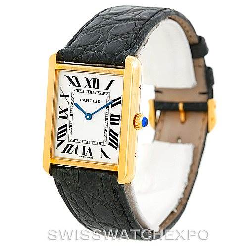 The Cartier Tank Solo W1018855 Men's Steel and Gold (two tone) Silver Dial W1018855 Men's Steel and Gold (two tone) Silver Dial model watch is shown at a slight angle, displaying its rectangular face, Roman numerals, black leather strap, and gold casing with a blue cabochon crown.