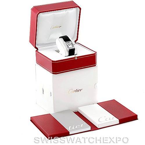 The image shows a Cartier Tank Solo W1018355 Men's Stainless Steel Silver Dial W1018355 Men's Stainless Steel Silver Dial watch from a top-angle, inside its box with accompanying packaging and documentation.