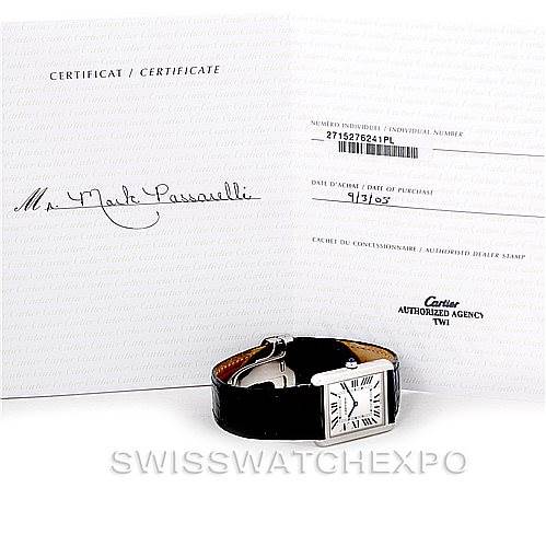 The image shows a Cartier Tank Solo W1018355 Men's Stainless Steel Silver Dial W1018355 Men's Stainless Steel Silver Dial watch placed in front of its certification documents from an authorized agency.