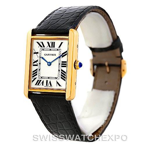 The image shows a Cartier Tank Solo W1018855 Men's Steel and Gold (two tone) Silver Dial W1018855 Men's Steel and Gold (two tone) Silver Dial watch at a slight angle, highlighting its rectangular face, black leather strap, and gold casing with Roman numerals.