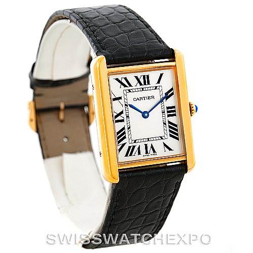 The image shows a Cartier Tank Solo W1018855 Men's Steel and Gold (two tone) Silver Dial W1018855 Men's Steel and Gold (two tone) Silver Dial watch angled to display its black leather strap, rectangular face with Roman numerals, and gold casing.