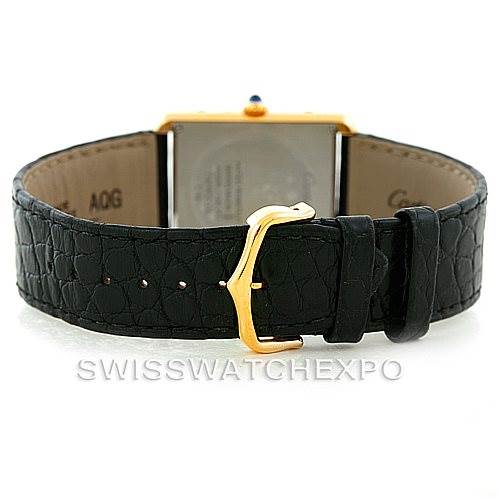 The image shows the back view of a Cartier Tank Solo W1018855 Men's Steel and Gold (two tone) Silver Dial W1018855 Men's Steel and Gold (two tone) Silver Dial watch, emphasizing the black leather strap and gold buckle.