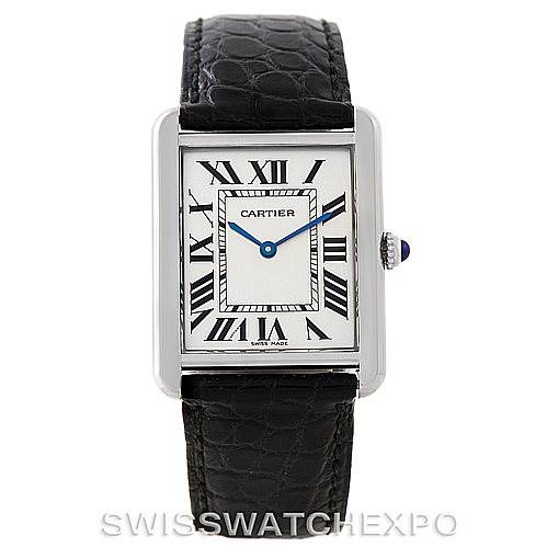 The image shows a frontal view of a Cartier Tank Solo W1018355 Men
s Stainless Steel Silver Dial W1018355 Men
s Stainless Steel Silver Dial watch, highlighting the dial, Roman numerals, blue hands, and black leather strap.