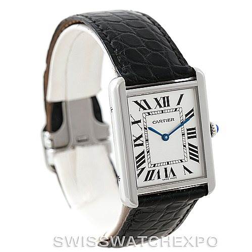The image shows a Cartier Tank Solo W1018355 Men
s Stainless Steel Silver Dial W1018355 Men
s Stainless Steel Silver Dial watch at a slight angle, highlighting its face, Roman numerals, rectangular case, and black leather strap.