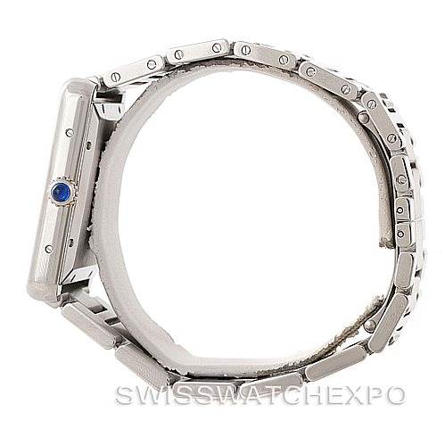Side view of the Cartier Tank Solo W5200028 Men
s Stainless Steel Silver Dial W5200028 Men
s Stainless Steel Silver Dial watch, showing the case, crown with blue gem, and part of the metal bracelet.