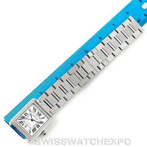 The Cartier Tank Solo W5200028 Men
s Stainless Steel Silver Dial W5200028 Men
s Stainless Steel Silver Dial watch is shown from an overhead angle, displaying the face and full metal bracelet alongside a blue ruler.