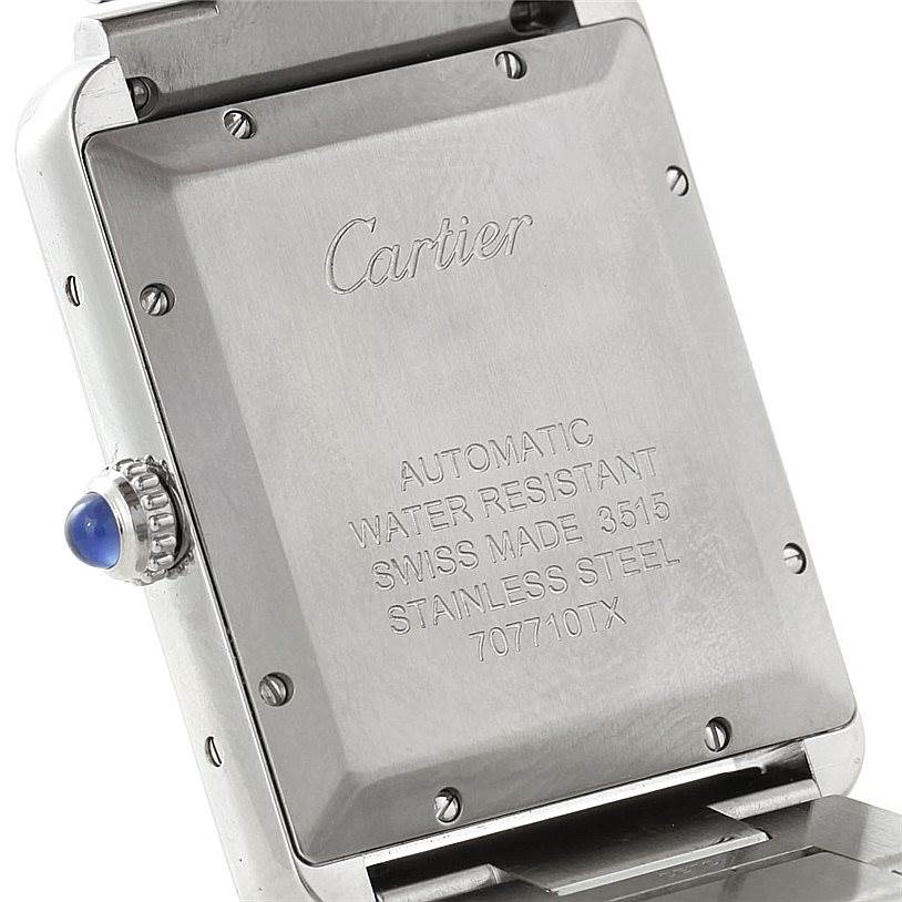 The image shows the back of a Cartier Tank Solo W5200028 Men
s Stainless Steel Silver Dial W5200028 Men
s Stainless Steel Silver Dial watch, highlighting its inscriptions and stainless steel case.