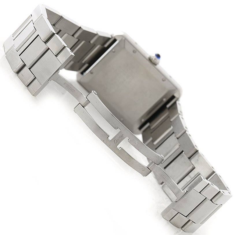 This image shows the open clasp and case back of a Cartier Tank Solo W5200028 Men
s Stainless Steel Silver Dial W5200028 Men
s Stainless Steel Silver Dial watch from a rear angle.