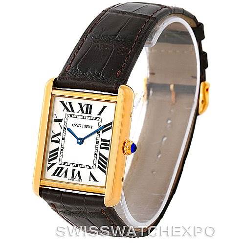 This image shows a Cartier Tank Solo W1018855 Men
s Steel and Gold (two tone) Silver Dial W1018855 Men
s Steel and Gold (two tone) Silver Dial watch from a 3/4 angle, highlighting the rectangular case, Roman numeral dial, and leather strap.