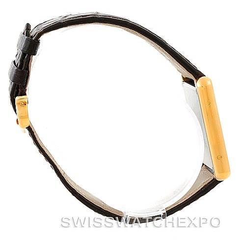 This image shows a side profile view of the Cartier Tank Solo W1018855 Men
s Steel and Gold (two tone) Silver Dial W1018855 Men
s Steel and Gold (two tone) Silver Dial watch, focusing on its gold case and leather strap.