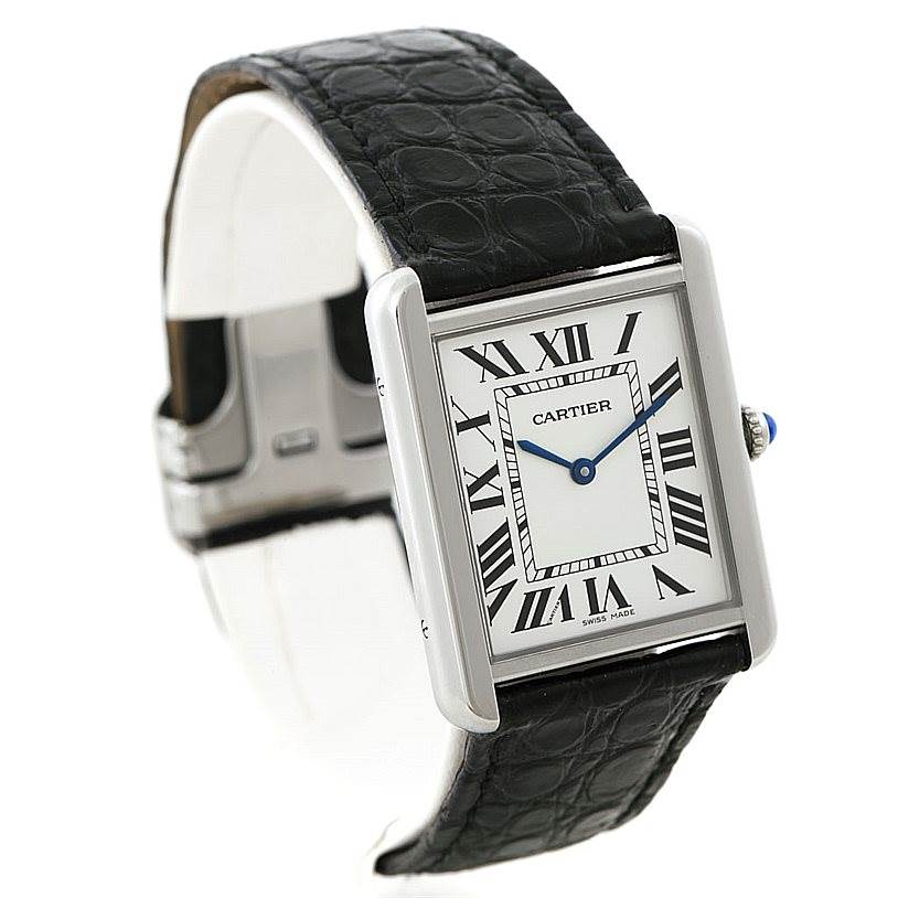 The image shows a Cartier Tank Solo W1018355 Men
s Stainless Steel Silver Dial W1018355 Men
s Stainless Steel Silver Dial model watch at a slight tilt, revealing the rectangular face, Roman numerals, and black leather strap.
