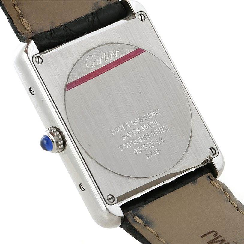 The image shows the back case of a Cartier Tank Solo W1018355 Men
s Stainless Steel Silver Dial W1018355 Men
s Stainless Steel Silver Dial watch, highlighting its water-resistant marking and stainless steel back.