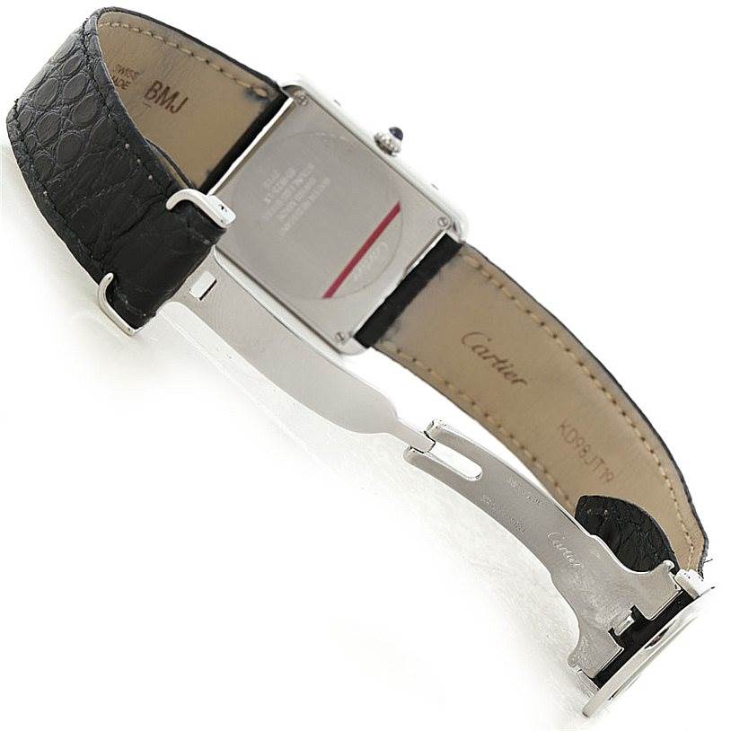 The image shows the back of a Cartier Tank Solo W1018355 Men
s Stainless Steel Silver Dial W1018355 Men
s Stainless Steel Silver Dial watch, including the leather strap and clasp.