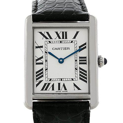 The Cartier Tank Solo W1018355 Men
s Stainless Steel Silver Dial W1018355 Men
s Stainless Steel Silver Dial watch is shown from the front, detailing its rectangular face, Roman numerals, and black leather strap.