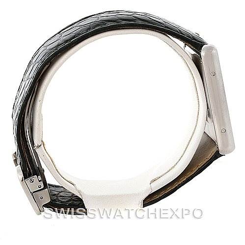 This image shows a Cartier Tank Solo W1018355 Men
s Stainless Steel Silver Dial W1018355 Men
s Stainless Steel Silver Dial watch from a side angle, highlighting the case and the leather strap.