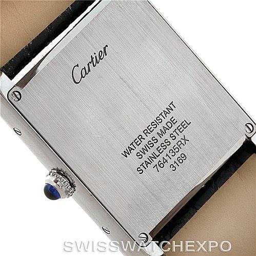 This image shows the back case of a Cartier Tank Solo W1018355 Men
s Stainless Steel Silver Dial W1018355 Men
s Stainless Steel Silver Dial watch, highlighting its engravings and crown.