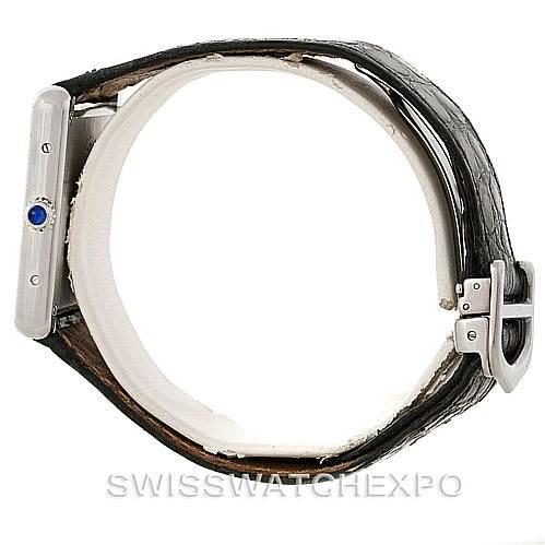This image shows the side view of a Cartier Tank Solo W1018355 Men
s Stainless Steel Silver Dial W1018355 Men
s Stainless Steel Silver Dial watch, highlighting the crown with a blue cabochon, strap, and buckle.