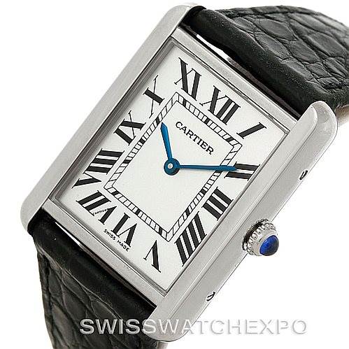 The Cartier Tank Solo W1018355 Men
s Stainless Steel Silver Dial W1018355 Men
s Stainless Steel Silver Dial watch is shown at an angle highlighting its face, Roman numerals, blue hands, and beaded crown with a cabochon.