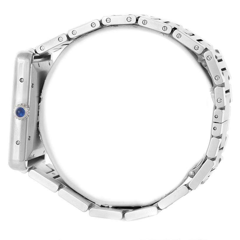 The image shows a side view of the Tank Solo model by Cartier, focusing on the bracelet and crown.