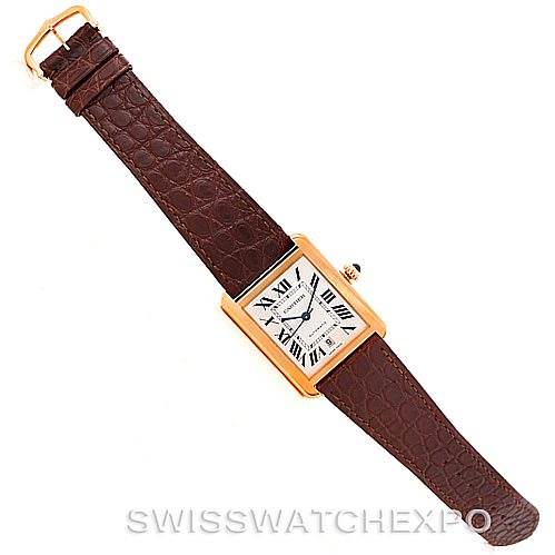 The image shows a Cartier Tank Solo W5200026 Men
s Steel and Gold (two tone) Silver Dial W5200026 Men
s Steel and Gold (two tone) Silver Dial watch laid flat, displaying the face, brown leather strap, and gold buckle from a top-down angle.