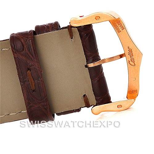 This image shows a close-up of the buckle and leather strap of a Tank Solo model watch by Cartier.