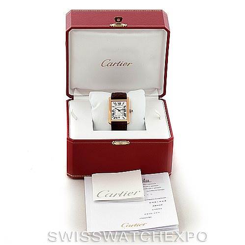 This image shows a Cartier Tank Solo W5200026 Men
s Steel and Gold (two tone) Silver Dial W5200026 Men
s Steel and Gold (two tone) Silver Dial watch from a front angle, displayed in its open red box with accompanying booklets.