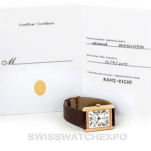 The image shows the Cartier Tank Solo W5200026 Men
s Steel and Gold (two tone) Silver Dial W5200026 Men
s Steel and Gold (two tone) Silver Dial watch with its certificate, displaying its front face and strap at a slight angle.