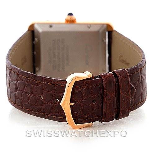 The image shows the back view of a Cartier Tank Solo W5200026 Men
s Steel and Gold (two tone) Silver Dial W5200026 Men
s Steel and Gold (two tone) Silver Dial watch, highlighting the brown leather strap and gold buckle.