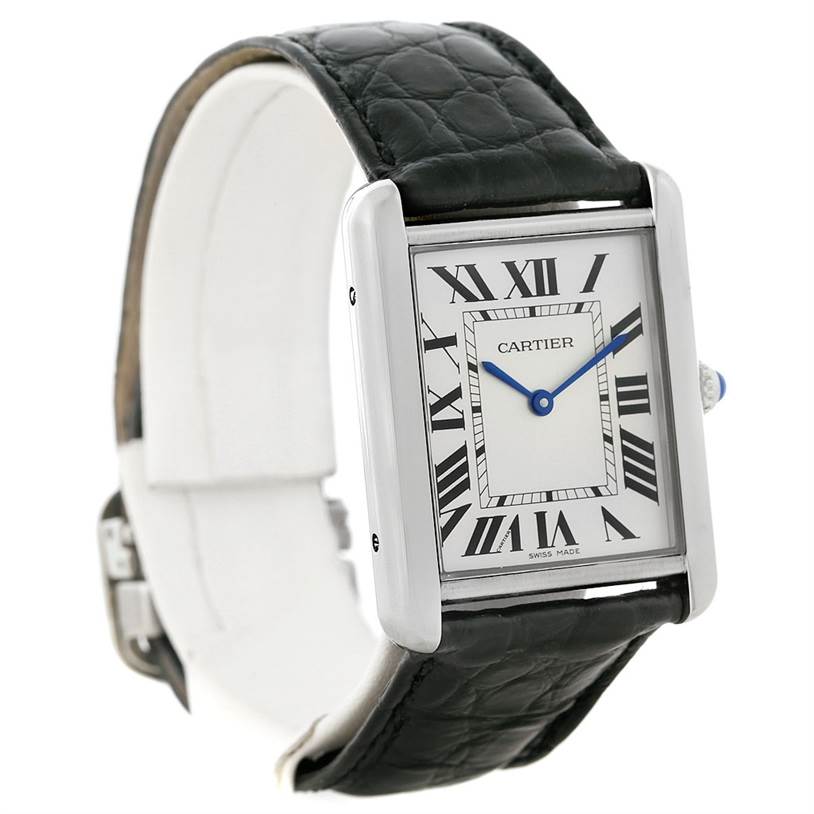 The Tank Solo by Cartier is shown from a front angle, highlighting its rectangular face, black leather strap, and Roman numeral dial.