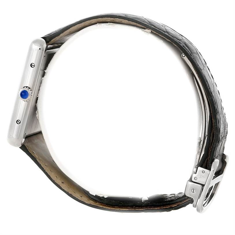 This image shows a side view of the Cartier Tank Solo W1018355 Men
s Stainless Steel Silver Dial W1018355 Men
s Stainless Steel Silver Dial watch, featuring the crown with a blue cabochon and leather strap with buckle.