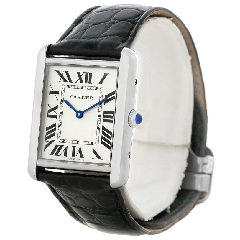 The Cartier Tank Solo W1018355 Men
s Stainless Steel Silver Dial W1018355 Men
s Stainless Steel Silver Dial watch is shown at a slight angle, displaying its rectangular face, roman numerals, blue hands, and black leather strap.