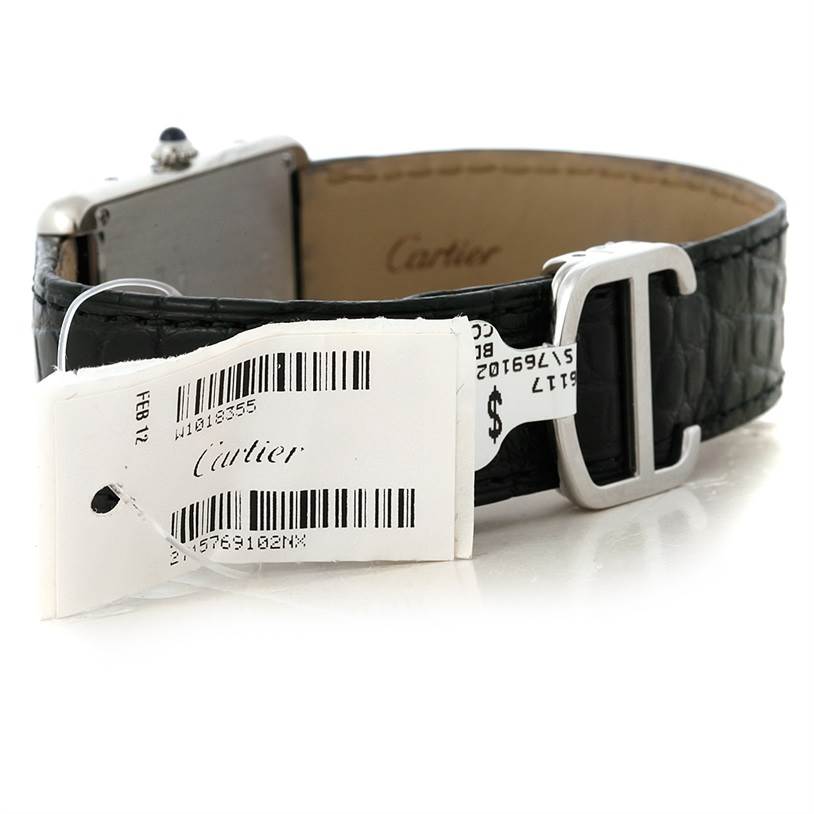 This image shows the black leather strap and metal clasp of the Cartier Tank Solo W1018355 Men
s Stainless Steel Silver Dial W1018355 Men
s Stainless Steel Silver Dial watch from a rear angle.