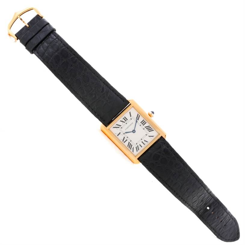 The Cartier Tank Solo W1018855 Men
s Steel and Gold (two tone) Silver Dial W1018855 Men
s Steel and Gold (two tone) Silver Dial model watch is shown from an overhead angle, displaying the face, strap, and buckle.