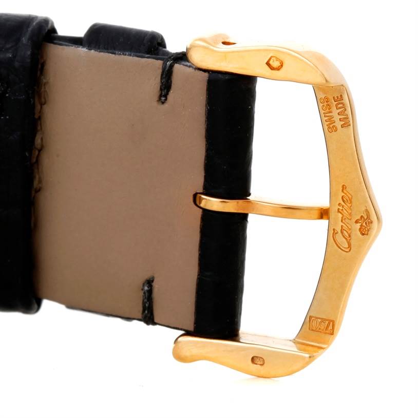 The image shows a close-up of the buckle and leather strap of a Cartier Tank Solo W1018855 Men
s Steel and Gold (two tone) Silver Dial W1018855 Men
s Steel and Gold (two tone) Silver Dial watch.