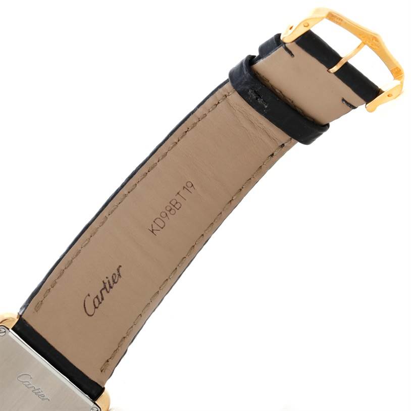 The image shows a close-up underside view of the strap and clasp of a Tank Solo watch by Cartier.