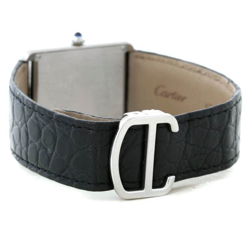 The image shows the rear view of a Cartier Tank Solo W1018355 Men
s Stainless Steel Silver Dial W1018355 Men
s Stainless Steel Silver Dial watch with a focus on the clasp and leather strap.