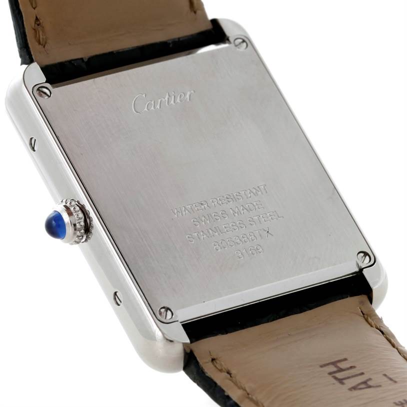 The image shows the back case and part of the strap of the Cartier Tank Solo W1018355 Men
s Stainless Steel Silver Dial W1018355 Men
s Stainless Steel Silver Dial watch, with the crown and case engravings visible.