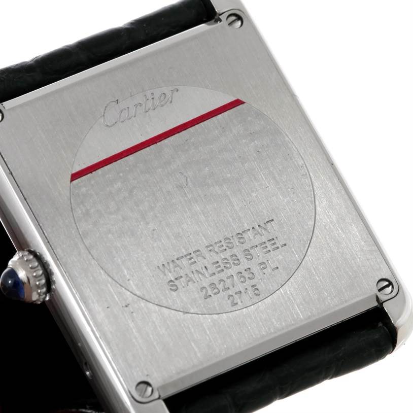 The image shows the back view of a Cartier Tank Solo W1018355 Men's Stainless Steel Silver Dial W1018355 Men's Stainless Steel Silver Dial watch, highlighting its stainless steel case and engravings.