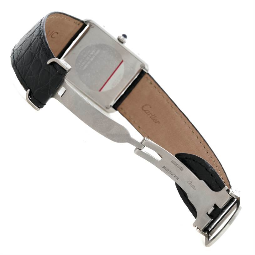 This image shows the back and opened clasp of a Cartier Tank Solo W1018355 Men's Stainless Steel Silver Dial W1018355 Men's Stainless Steel Silver Dial watch, highlighting its leather strap and stainless steel caseback.