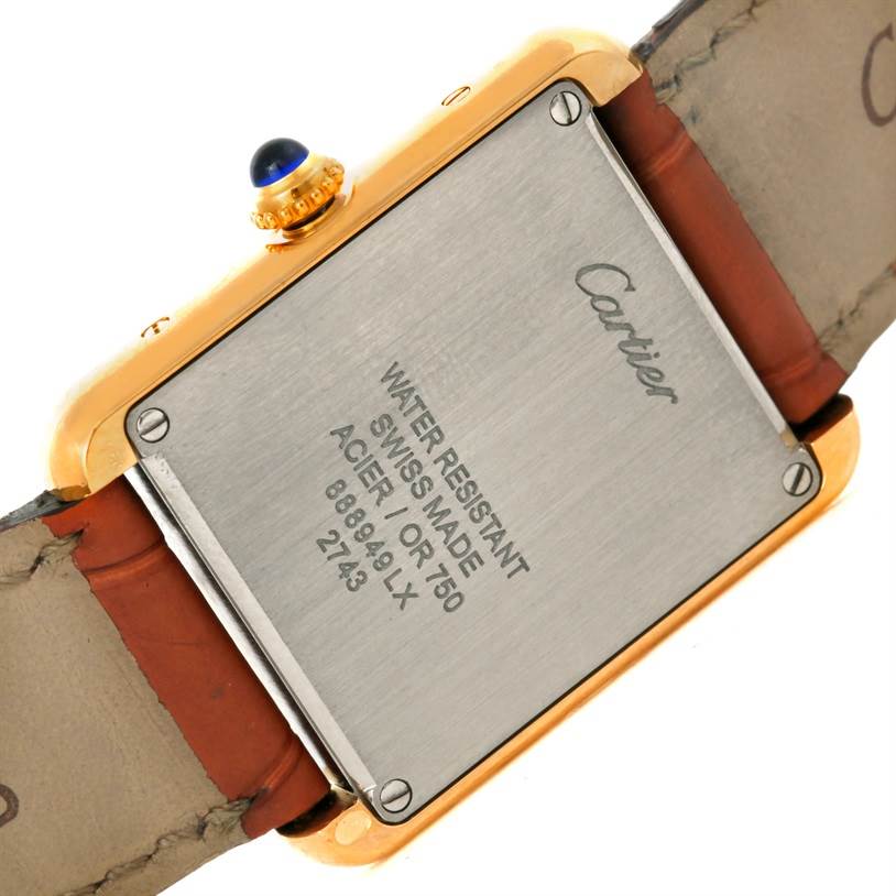 The image shows the back view of a Cartier Tank Solo W1018755 Women's Steel and Gold (two tone) Silver Dial W1018755 Women's Steel and Gold (two tone) Silver Dial watch, highlighting the case back and part of the leather strap.