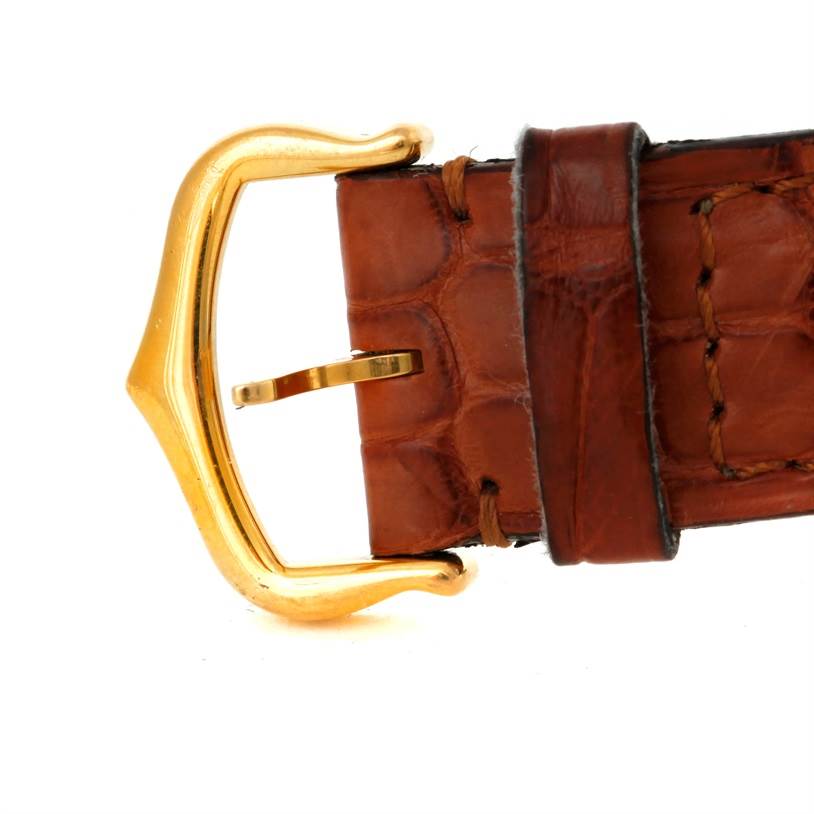 This image shows a close-up of the brown leather strap and gold buckle of the Cartier Tank Solo W1018755 Women's Steel and Gold (two tone) Silver Dial W1018755 Women's Steel and Gold (two tone) Silver Dial watch.