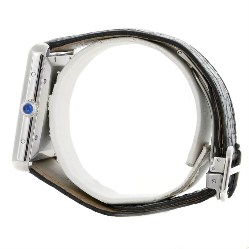 This image shows a side view of the Cartier Tank Solo W5200027 Men
s Stainless Steel Silver Dial W5200027 Men
s Stainless Steel Silver Dial watch, highlighting the crown and part of the strap.