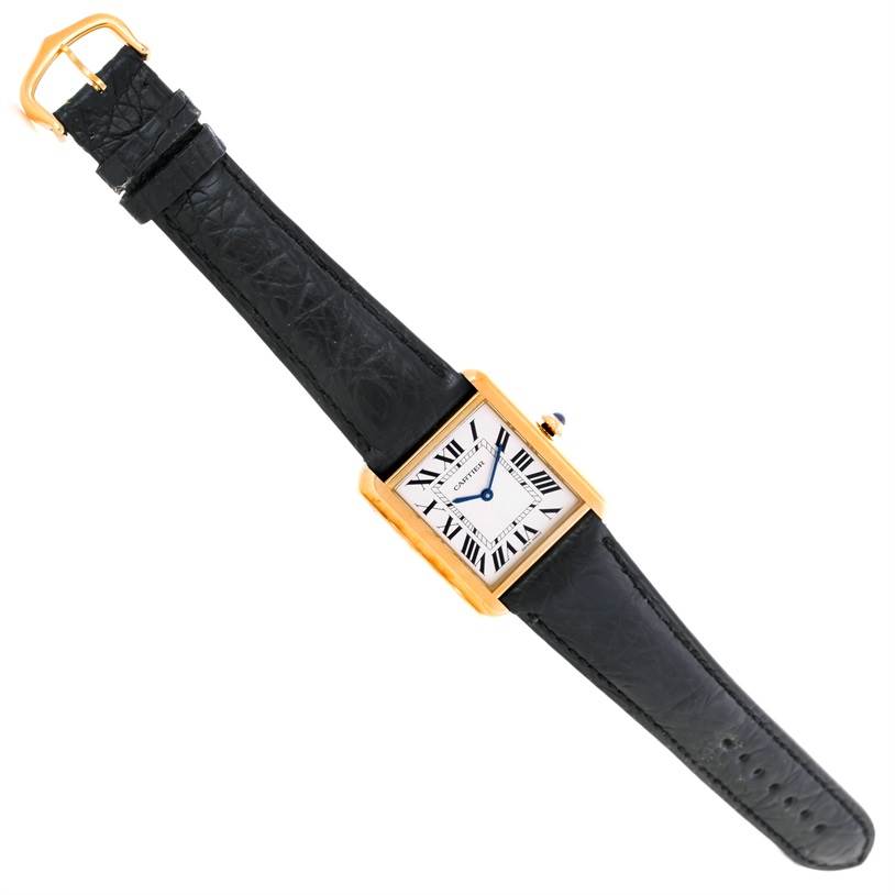 The Cartier Tank Solo W1018855 Men
s Steel and Gold (two tone) Silver Dial W1018855 Men
s Steel and Gold (two tone) Silver Dial watch is shown from a top-down angle, displaying the face, bezel, and strap.