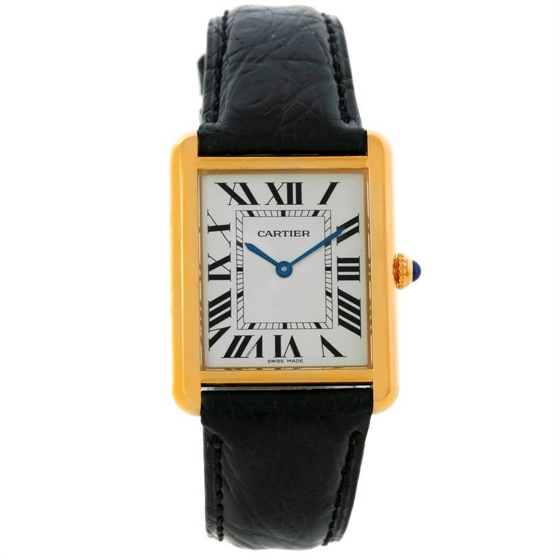 The Tank Solo by Cartier is shown in a frontal view, featuring its rectangular face, Roman numerals, and black leather strap.