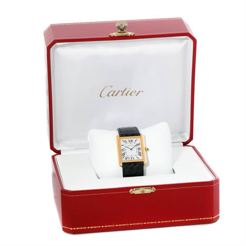 This image shows a Cartier Tank Solo W1018855 Men
s Steel and Gold (two tone) Silver Dial W1018855 Men
s Steel and Gold (two tone) Silver Dial watch placed inside its open red presentation box.