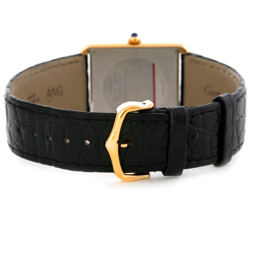 The image shows the back of the Cartier Tank Solo W1018855 Men
s Steel and Gold (two tone) Silver Dial W1018855 Men
s Steel and Gold (two tone) Silver Dial watch, highlighting the strap and buckle.